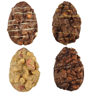 A collection of four different flavoured Rocky Road Easter eggs, each with a mix of chocolate and nuts, arranged side by side.