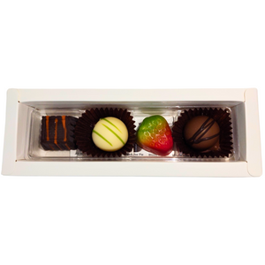 Introducing Poppy's Chocolate Gift Box, featuring four gourmet chocolates: a dark chocolate square with an orange drizzle, a green-striped white chocolate ball, a strawberry-shaped delicacy, and a round milk chocolate adorned with dark drizzle.