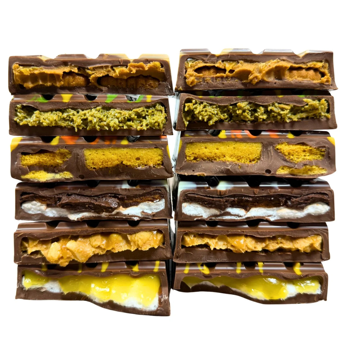 A stacked arrangement of five chocolate bars with various colorful fillings, including yellow, green, orange, and white, isolated on a white background.