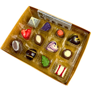 Experience the delight of a Gift Box featuring 12 gourmet chocolates, beautifully crafted into heart shapes, swirls, and marbled patterns. This elegant collection from Poppy's Chocolate is presented in a premium gift box and weighs 130 grams, making it an irresistible treat for any occasion.