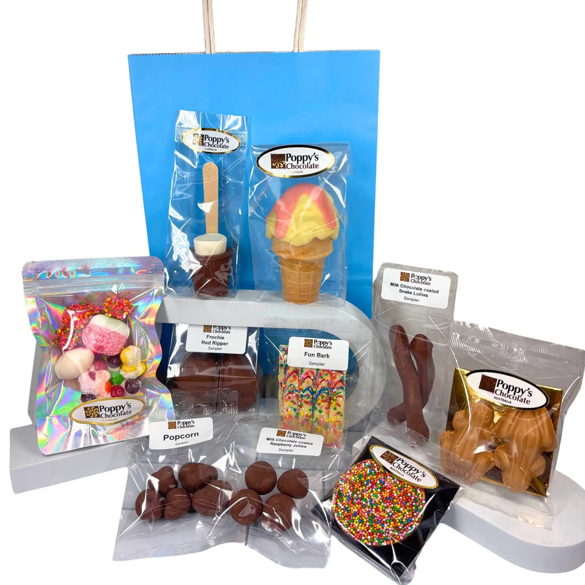 Poppy's Junior Show Bag features our exclusive handcrafted Chocolate Strawberry Sundae Waffle Cone for Kids and filled with chocolate samples, lollies, caramel popcorn, hot chocolate stick, chocolate frogs, fun bark, and sweet treats for kids.