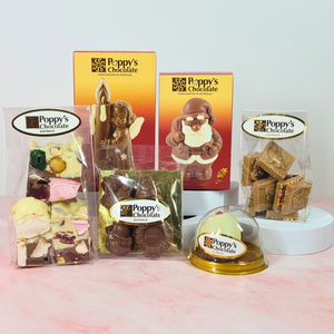 Poppy’s Favourite Christmas Treats Hamper contents, including rocky road, chocolate figures, squares and a mini pudding.