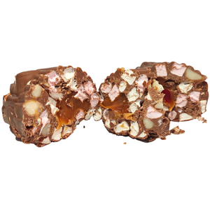 Angled close-up of rocky road log slices highlighting the chocolate, marshmallows and caramel filling