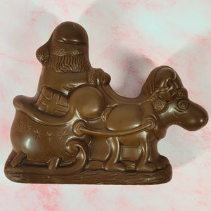 Reverse view of the milk chocolate Santa, reindeer and sleigh showing the moulded details.