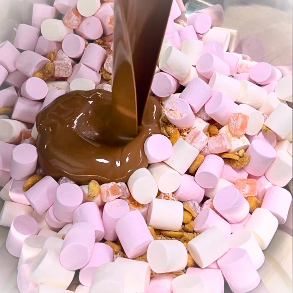 Turkish Delight and Cashews Milk Chocolate rocky road mixture making photograph