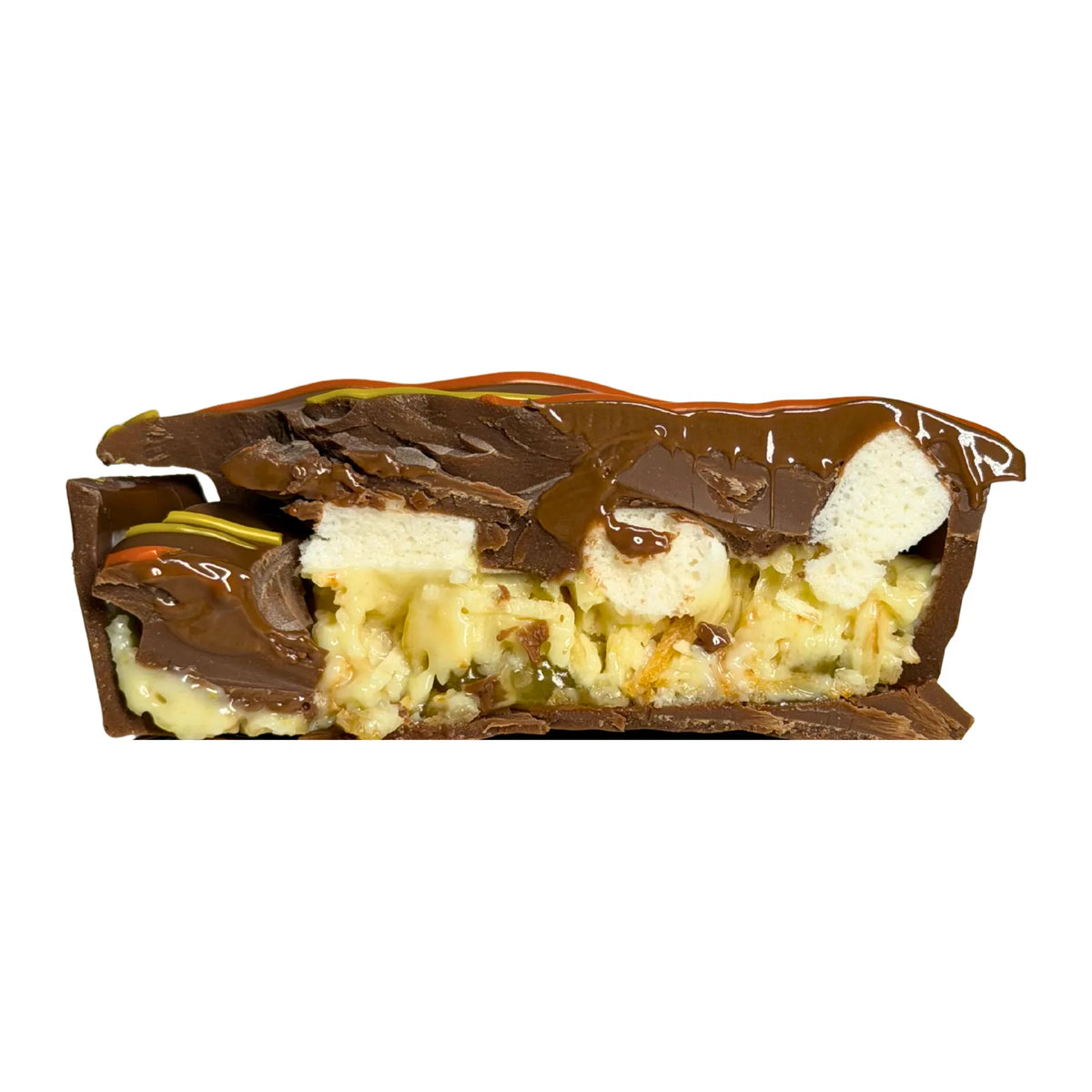Citrus Pie cut in half showing lemon curd, lime, mini marshmallows and milk chocolate filling with a shortbread biscuit.