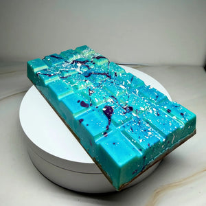Handmade milk chocolate Salted Caramel Chocolate Brownie Bliss Block with a blue and violet chocolate finish, gluten-free mud cake and gooey salted caramel filling.