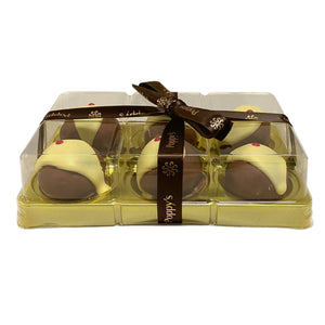 Front view of the six-piece mini chocolate pudding gift box with a clear lid and branded ribbon