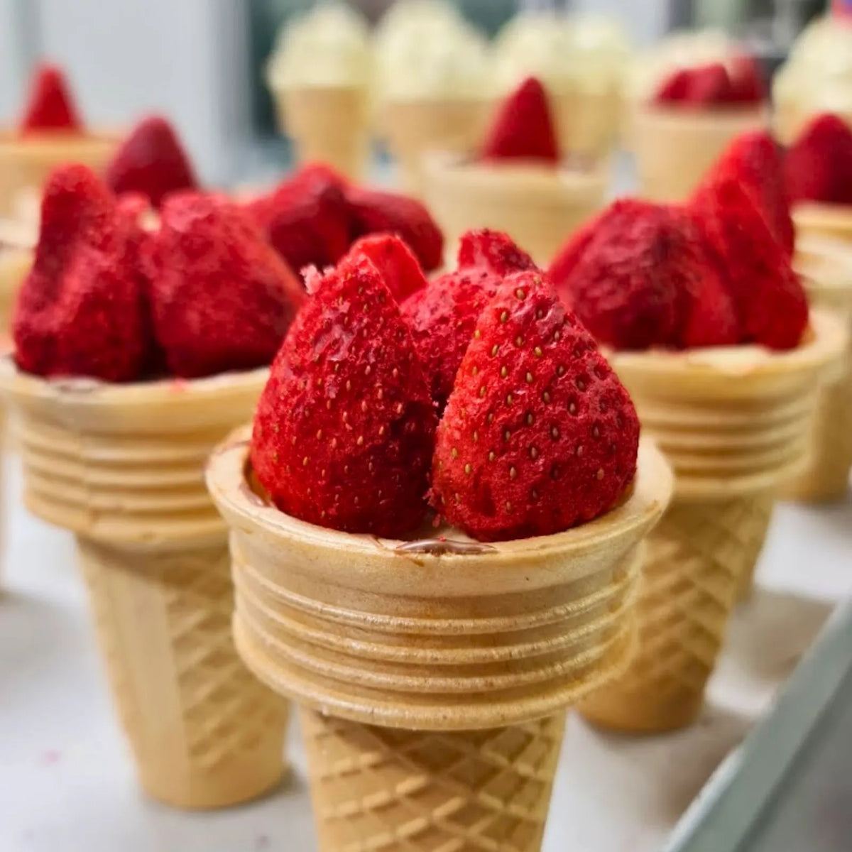 Poppy's Junior Show Bag features our exclusive handcrafted Chocolate Strawberry Sundae Waffle Cone for Kids and filled with chocolate samples, lollies, caramel popcorn, hot chocolate stick, chocolate frogs, fun bark, and sweet treats for kids.