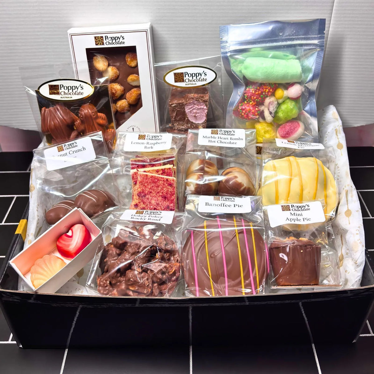 Poppy's 21st Birthday Treasure Box filled with exclusive handcrafted chocolates in a gourmet gift box.