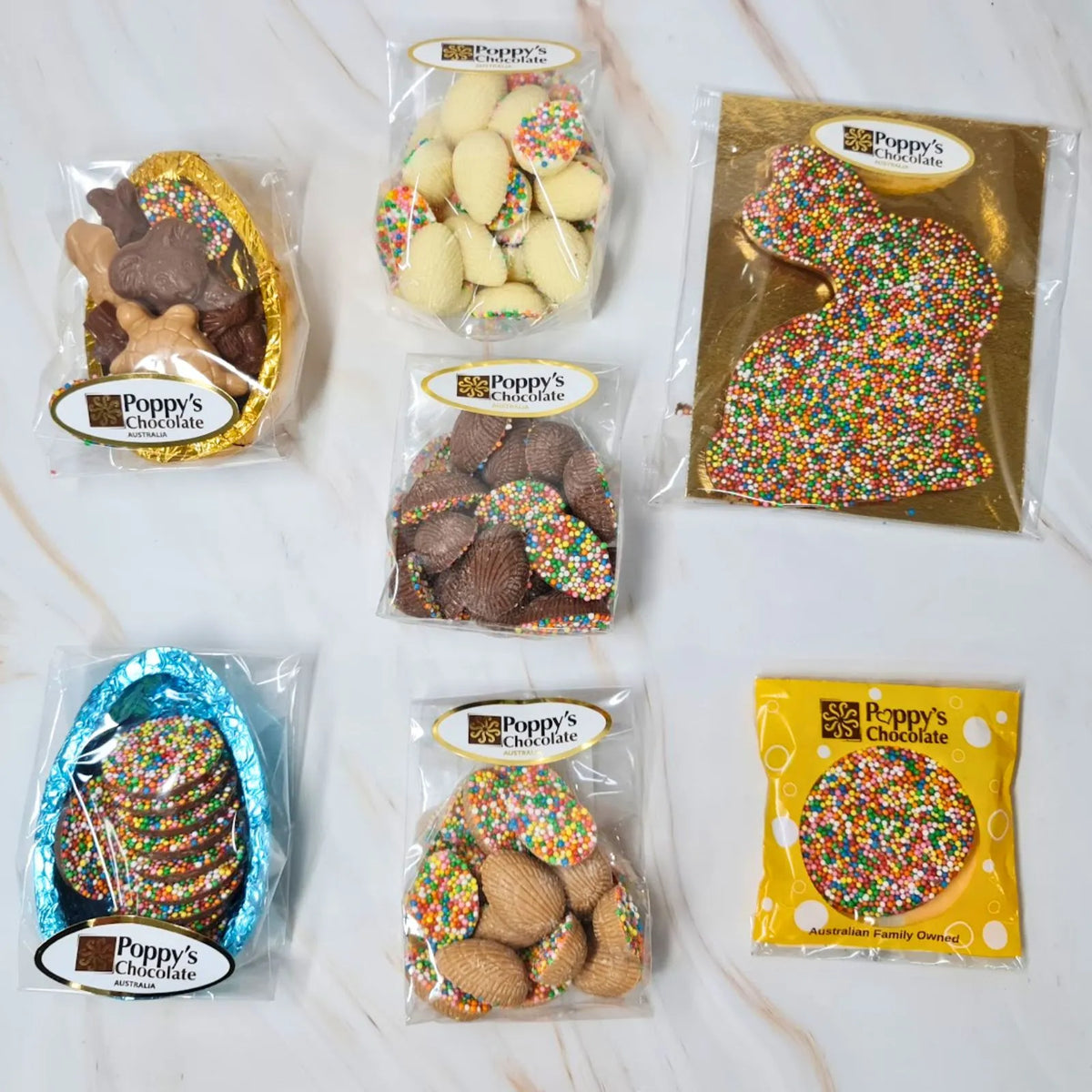 A hamper box from Poppy's Chocolate containing an assortment of Easter eggs and Easter Bunny chocolates sprinkled with 100s &amp; 1000s.
