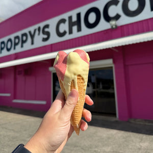 Poppy's Deluxe Show Bag featuring the exclusive handcrafted Chocolate Strawberry Sundae Waffle Cone alongside a selection of chocolate samples and gourmet treats.