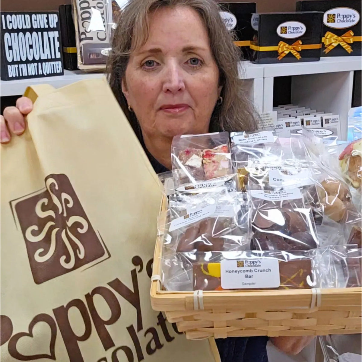 Poppy's Deluxe Show Bag featuring the exclusive handcrafted Chocolate Strawberry Sundae Waffle Cone alongside a selection of chocolate samples and gourmet treats.