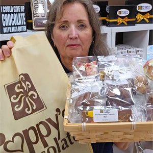 Poppy's Deluxe Show Bag featuring the exclusive handcrafted Chocolate Strawberry Sundae Waffle Cone alongside a selection of chocolate samples and gourmet treats.
