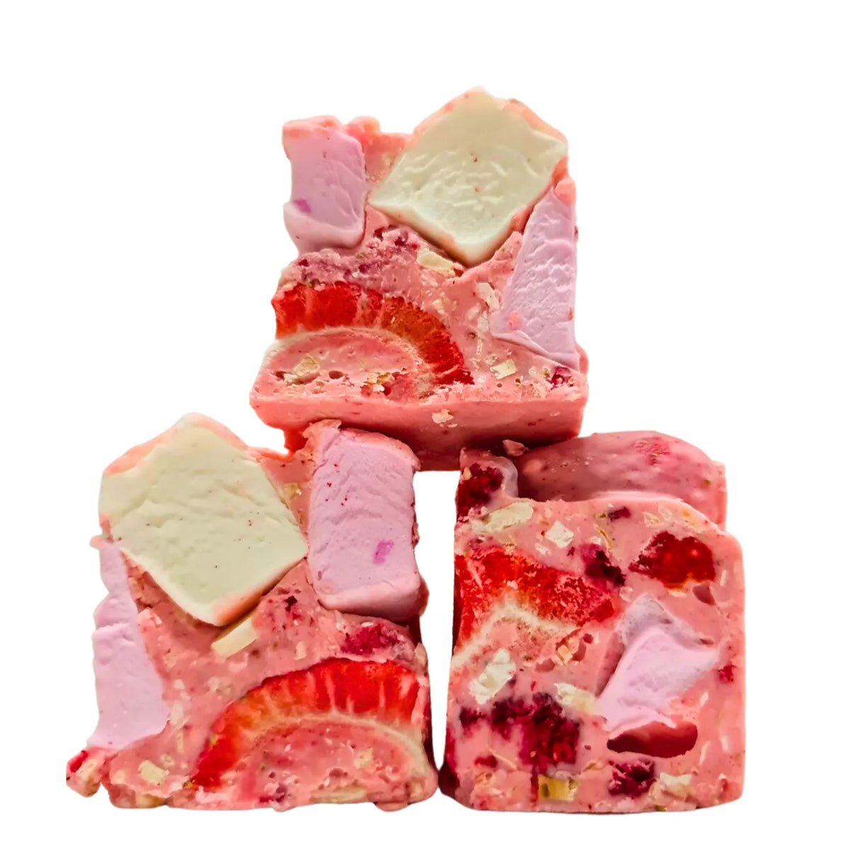 A stack of square-shaped Pink Blossom Rocky Road with visible ingredients such as marshmallows, freeze dried raspberries, and nuts.