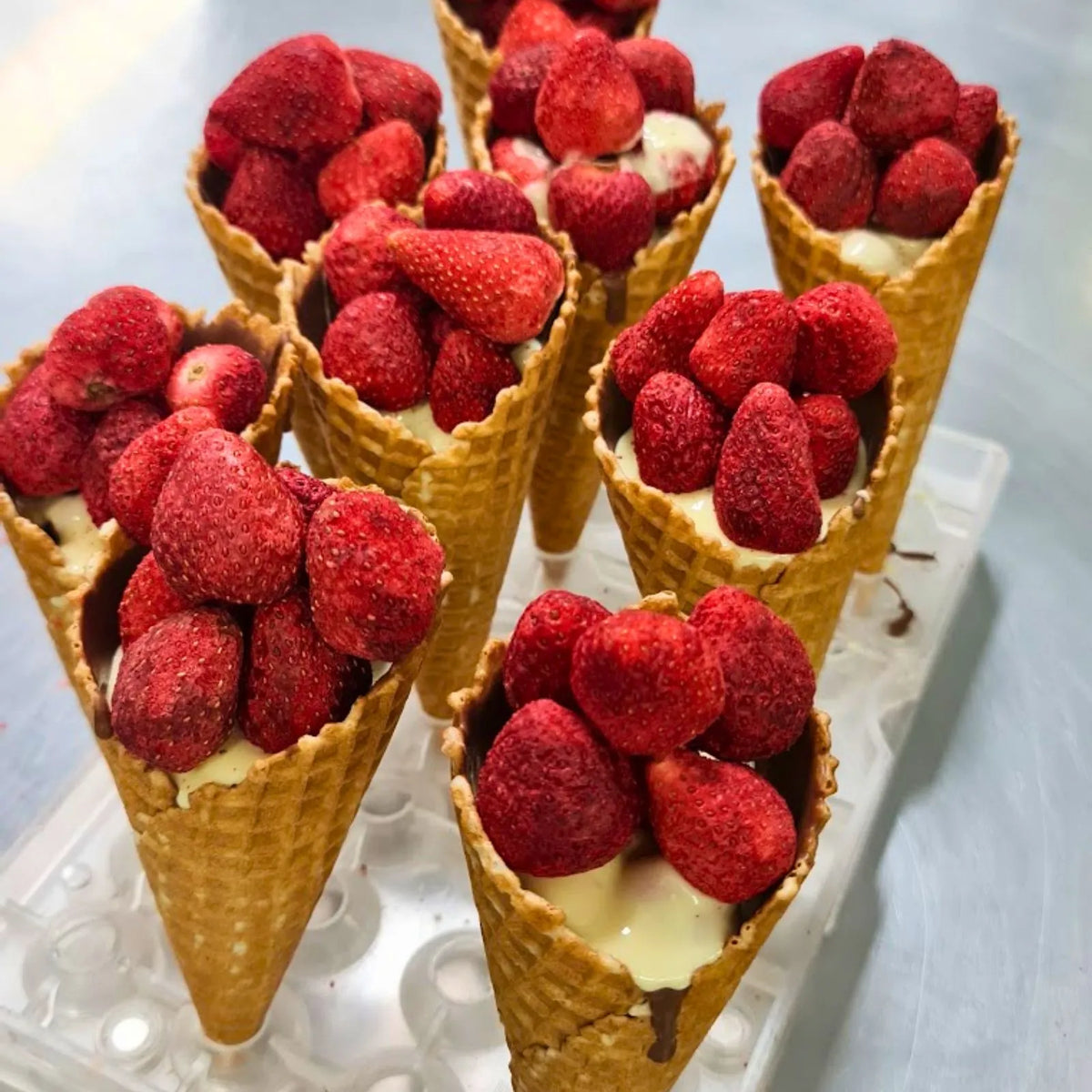 Poppy's Deluxe Show Bag featuring the exclusive handcrafted Chocolate Strawberry Sundae Waffle Cone alongside a selection of chocolate samples and gourmet treats.