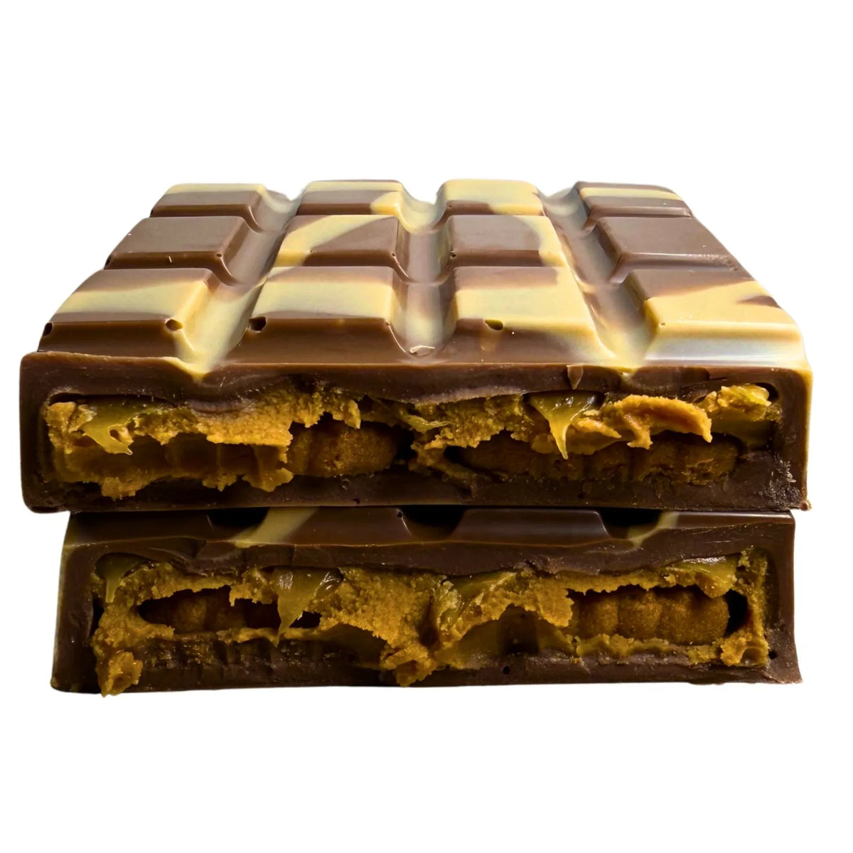 Chocolate block cut in half to show the cross-section, featuring a milk chocolate coating, a light chocolate grid pattern on top, and a golden-brown Biscoff filling biscuit and filling, set against a plain white background.
