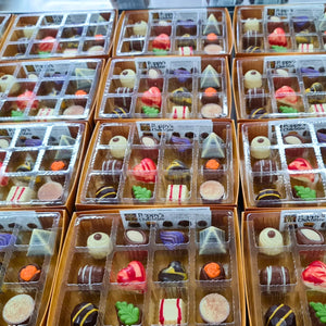 Experience the delight of a Gift Box featuring 12 gourmet chocolates, beautifully crafted into heart shapes, swirls, and marbled patterns. This elegant collection from Poppy's Chocolate is presented in a premium gift box and weighs 130 grams, making it an irresistible treat for any occasion.