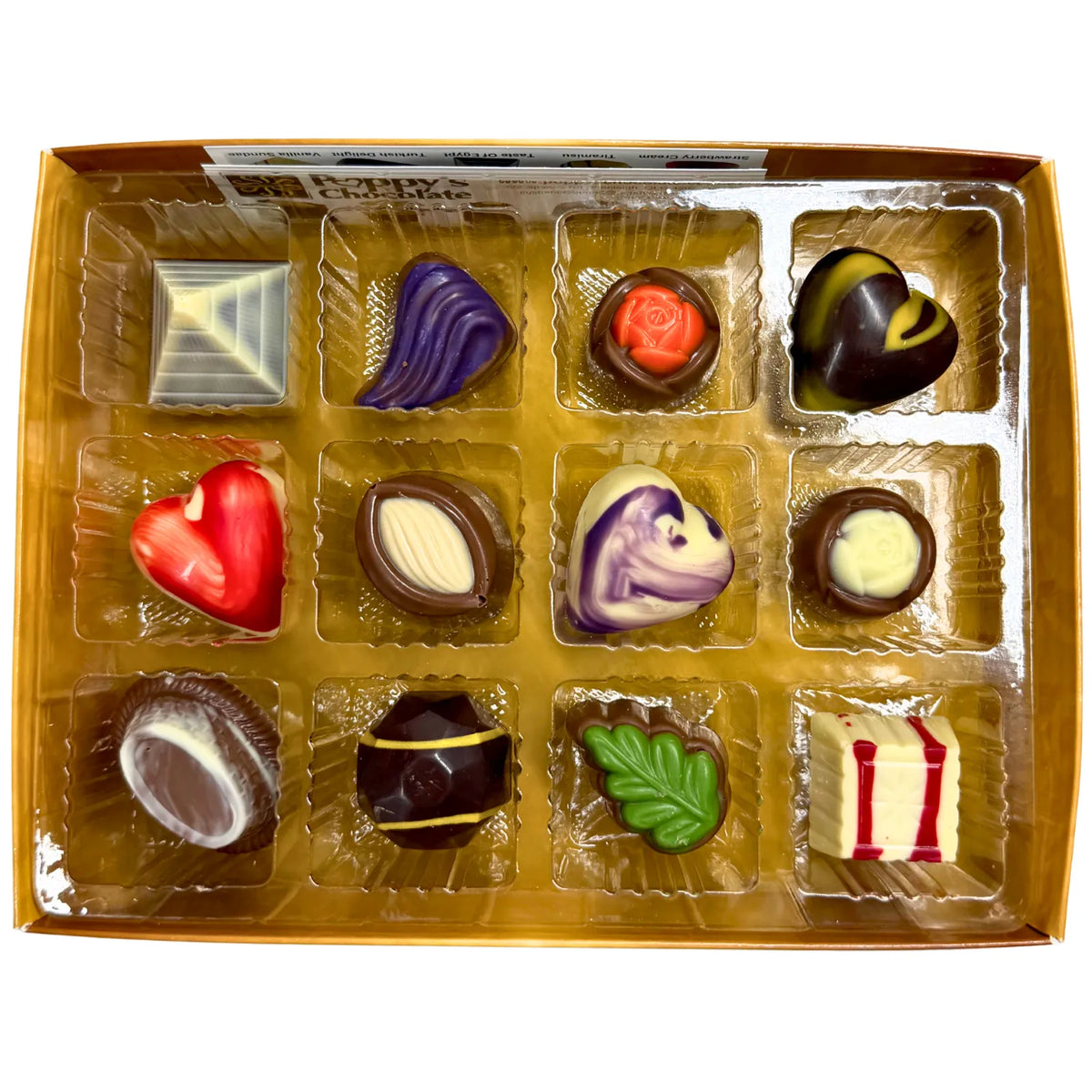 Experience the delight of a Gift Box featuring 12 gourmet chocolates, beautifully crafted into heart shapes, swirls, and marbled patterns. This elegant collection from Poppy's Chocolate is presented in a premium gift box and weighs 130 grams, making it an irresistible treat for any occasion.