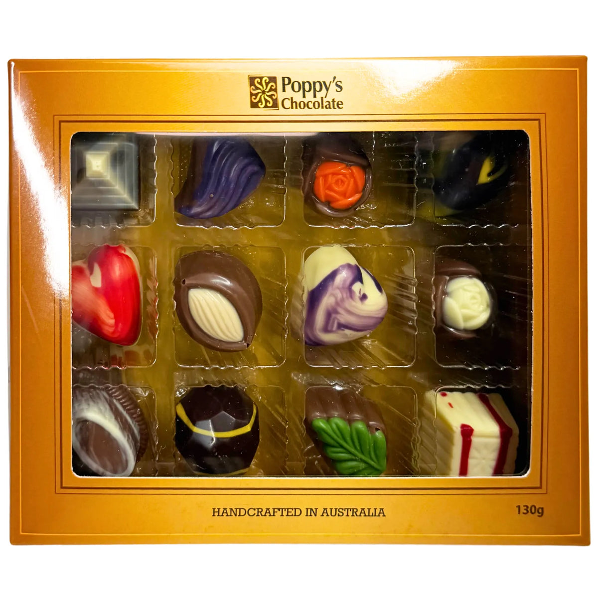 Experience the delight of a Gift Box featuring 12 gourmet chocolates, beautifully crafted into heart shapes, swirls, and marbled patterns. This elegant collection from Poppy's Chocolate is presented in a premium gift box and weighs 130 grams, making it an irresistible treat for any occasion.