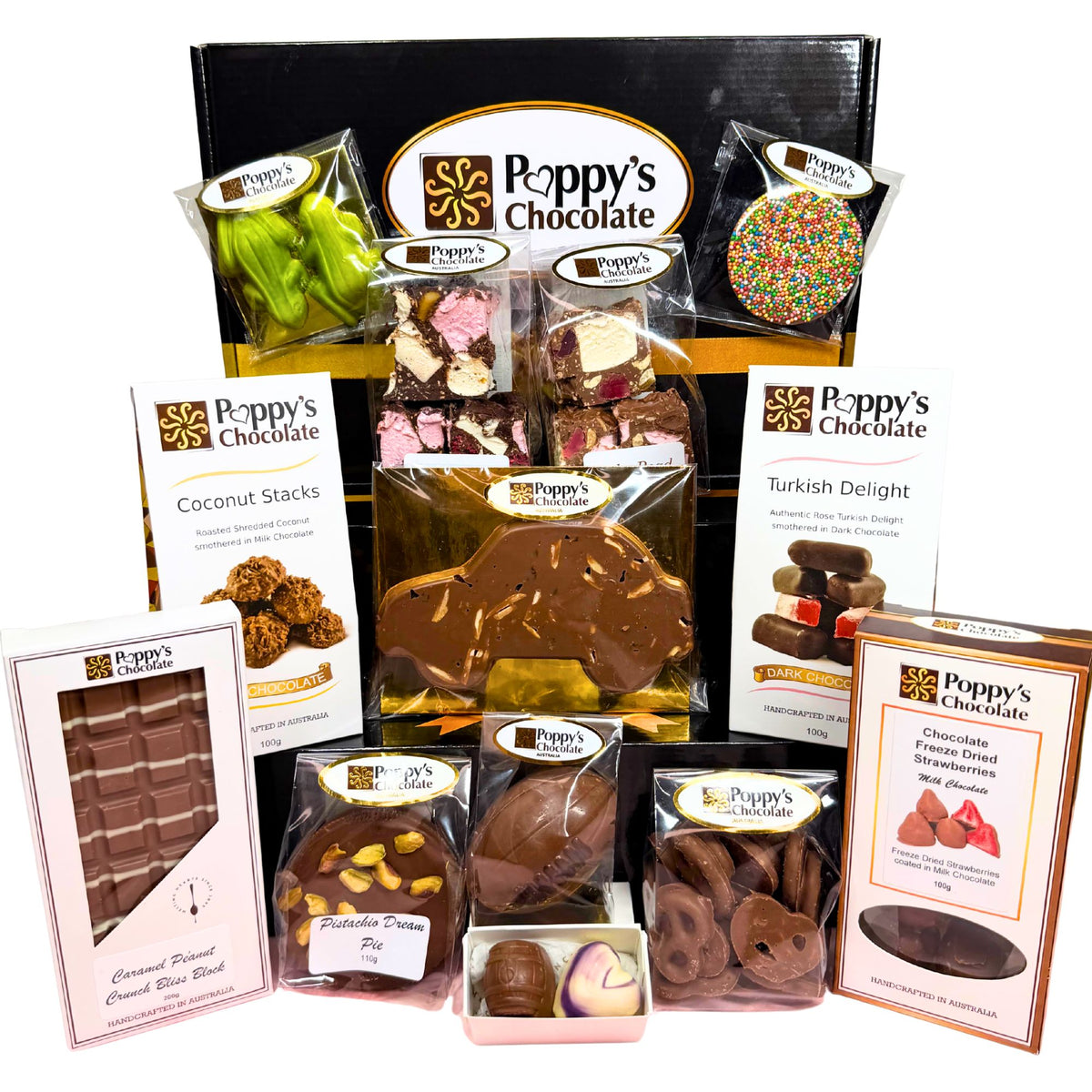 A Poppy's Chocolate gift hamper featuring an assortment of packaged chocolates, truffles, and chocolate bars arranged in front of a black gift box on a white background.