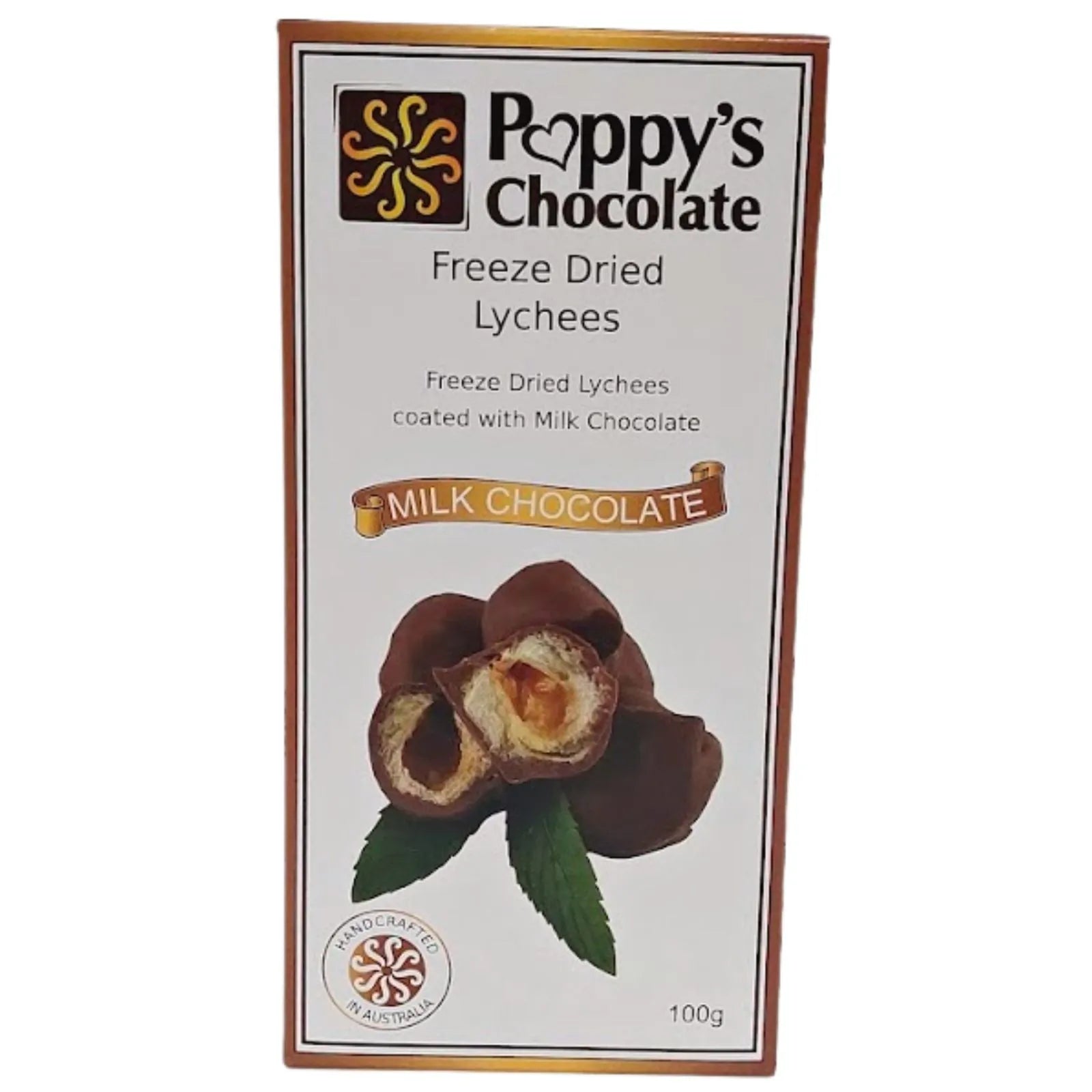 Chocolate-covered hazelnut candies with a cross-section showing the creamy filling and hazelnut core, garnished with two green mint leaves.