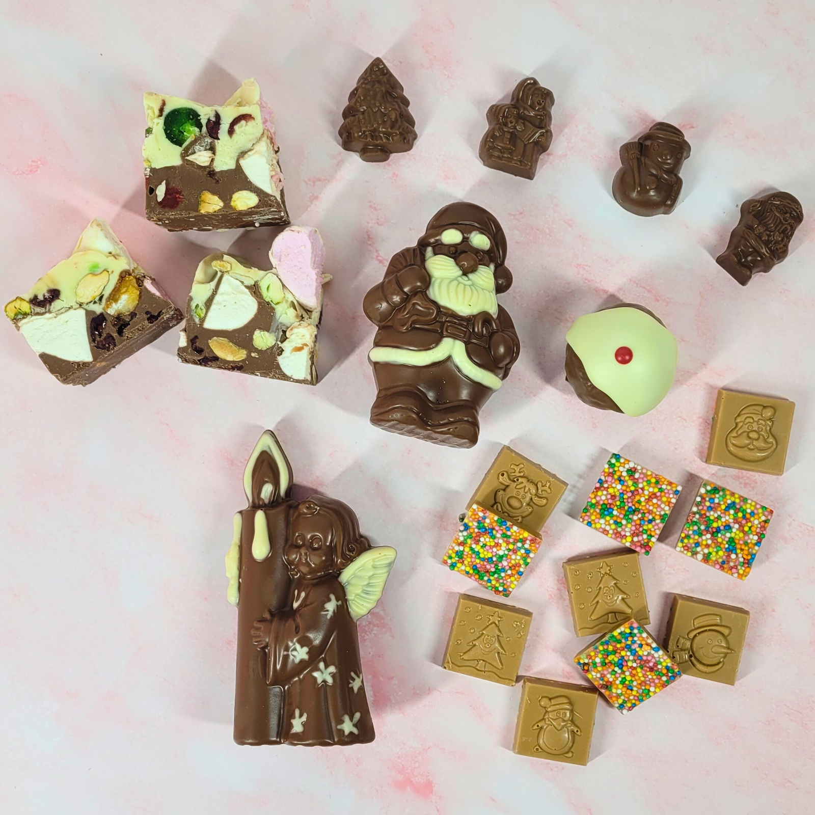 Poppy’s Favourite Christmas Treats Hamper contents, including rocky road, chocolate figures, squares and a mini pudding.