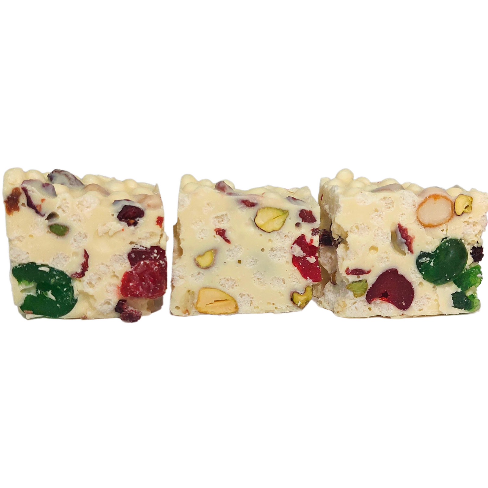 Three stacked pieces of Poppy’s White Christmas with white chocolate, rice puffs, fruit and nuts