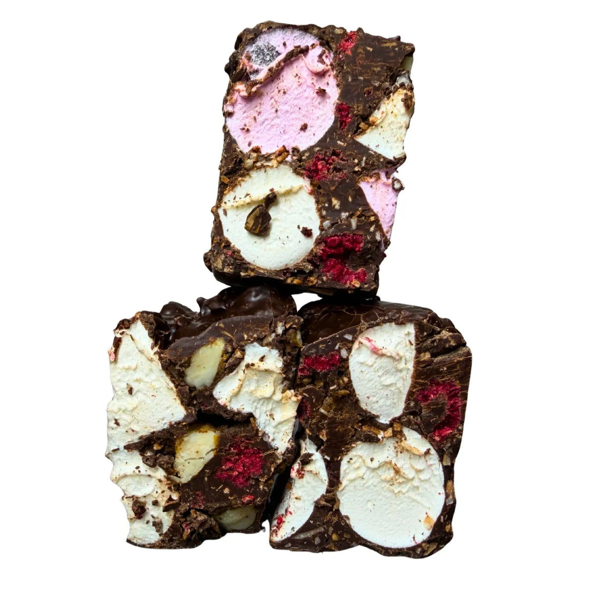Three stacked pieces of chocolate nut and berry freeze, featuring dark chocolate, white chocolate, pink marshmallow pieces, and red dried berries on a solid white background.