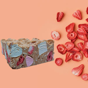 Strawberry and Almond Rocky Road in Caramel chocolate next to Freeze dried strawberries

