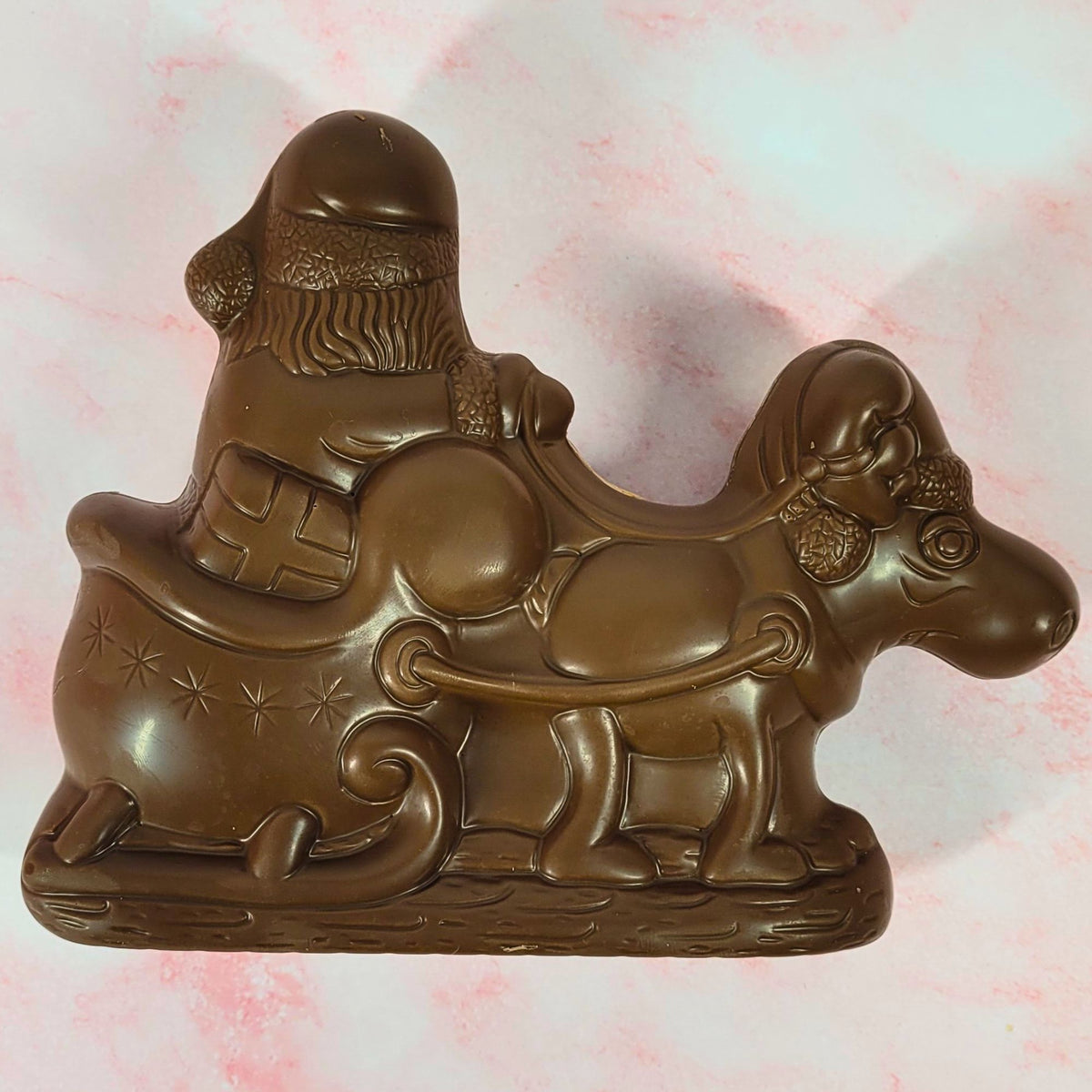 Reverse view of the milk chocolate Santa, reindeer and sleigh showing the moulded details.