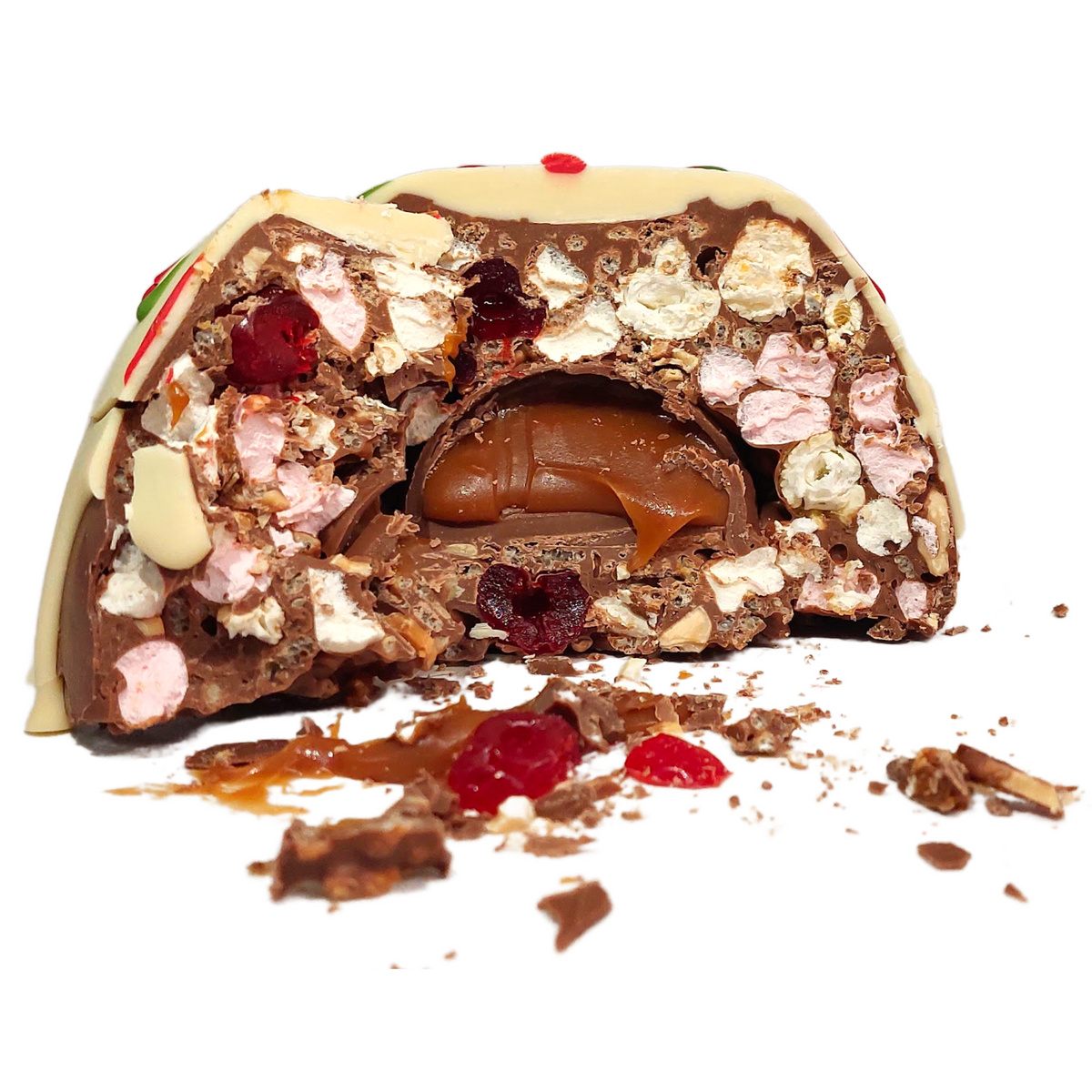 Bliss Dome cut open to reveal its filling, with a white chocolate topping and red and green decorations.