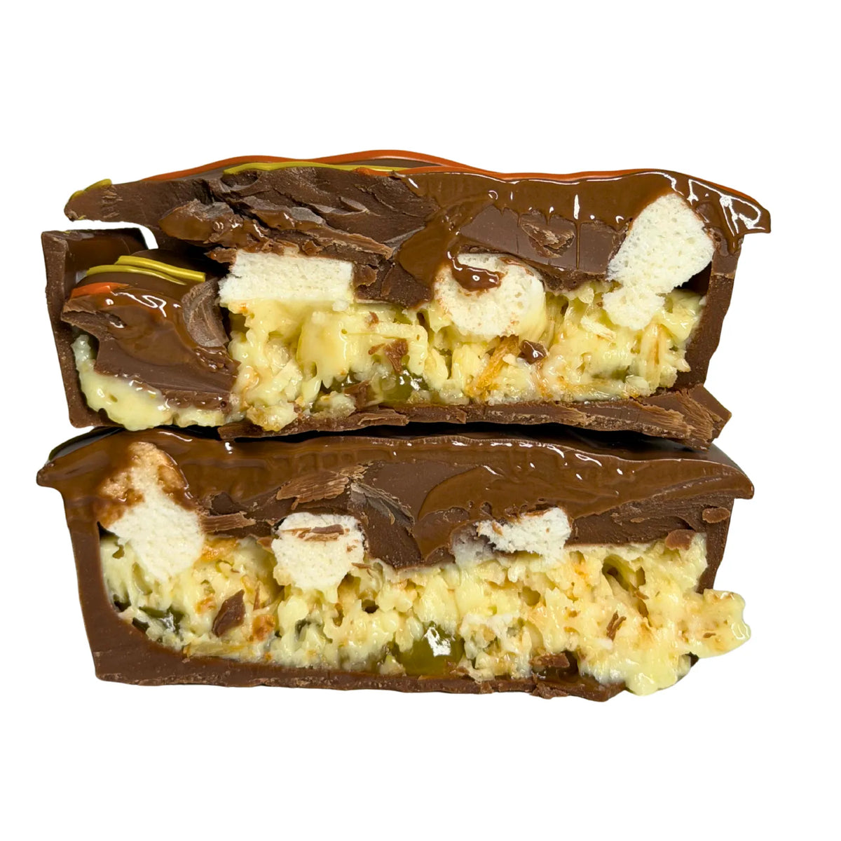 Citrus Pie cut in half showing lemon curd, lime, mini marshmallows and milk chocolate filling with a shortbread biscuit.