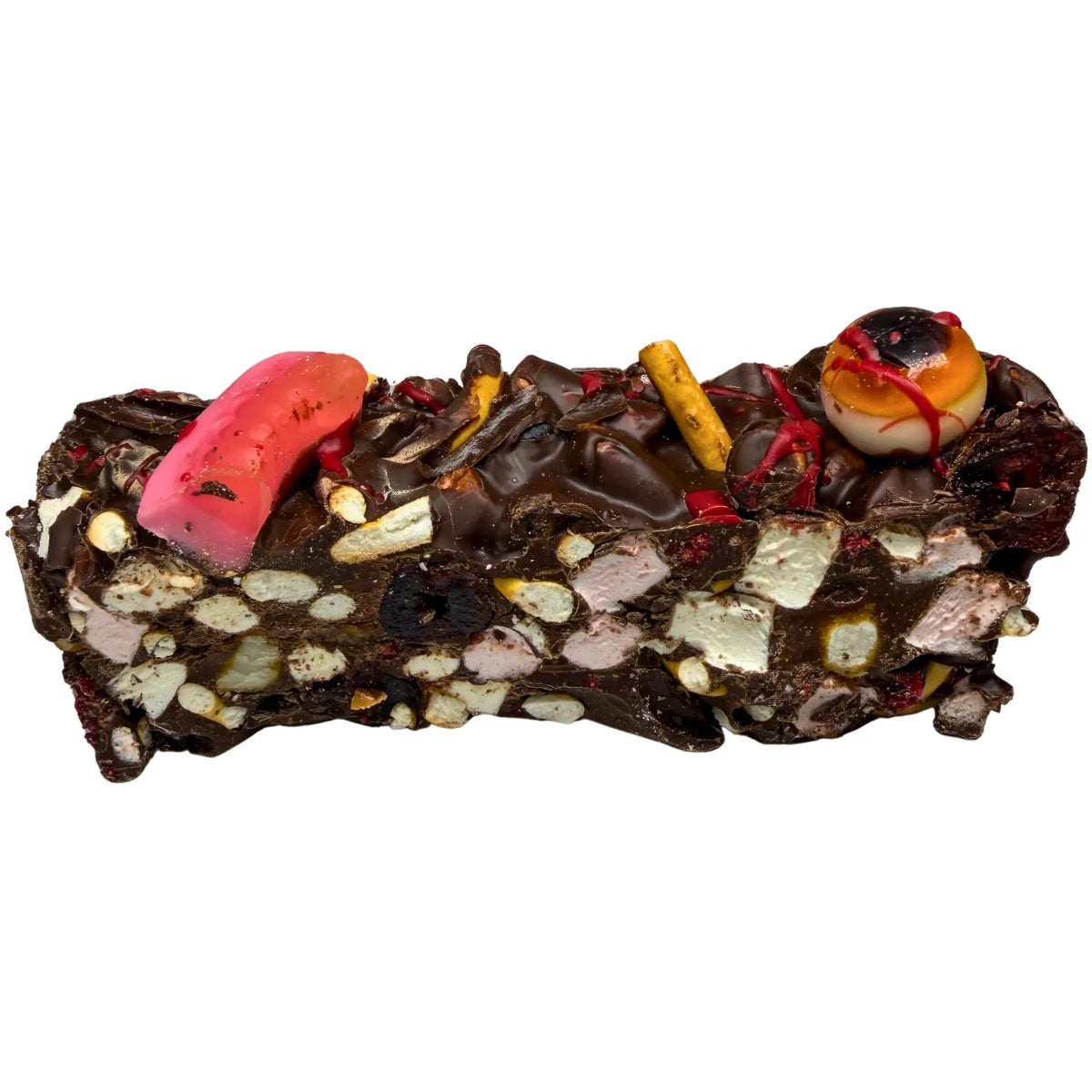 Angled view of Poppy’s Chocolate Graveyard Rocky Road showing its milk and dark chocolate base, pretzel pieces, red cherries and spooky edible decorations.