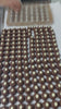 Demoulding Banoffee Pie chocolates out of chocolate mould and all of them come out at once