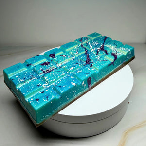 Handmade milk chocolate Salted Caramel Chocolate Brownie Bliss Block with a blue and violet chocolate finish, gluten-free mud cake and gooey salted caramel filling.
