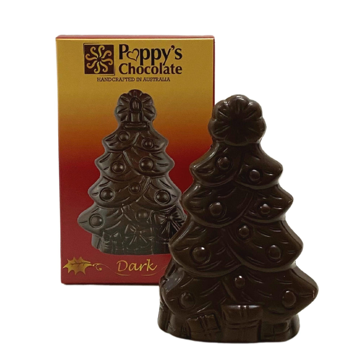Dark chocolate Christmas tree beside its red and gold Poppy’s Chocolate gift box.